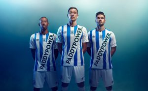 Three football players wearing Paddy Power kits